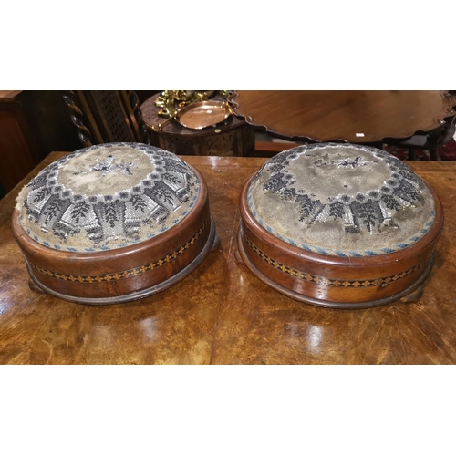 687 - A Victorian pair of walnut circular footstools with beaded decoration