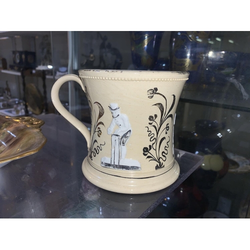 222 - A 19th century unusual waisted mug decorated with early cricketers