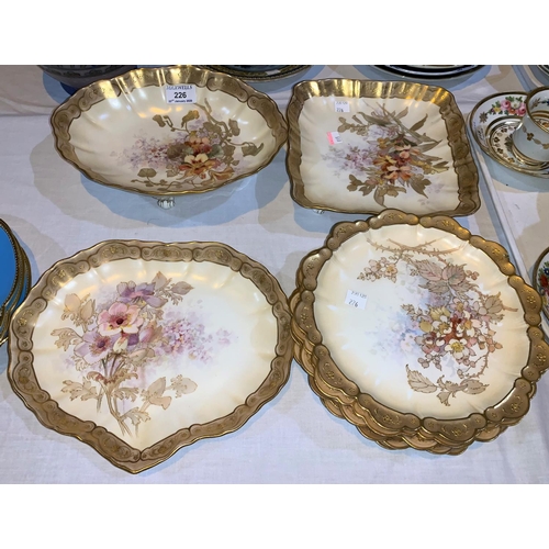 226 - A Doulton Burslem 9 piece dessert service decorated with floral sprays edged with raised giltwork