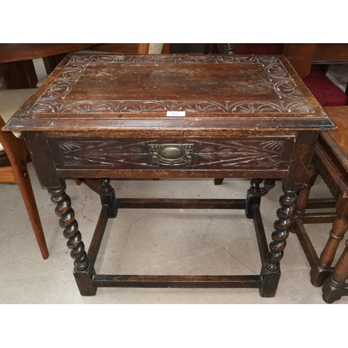 575 - A 19th century carved oak side table with rectangular top and frieze drawer, on barley twist legs; a... 