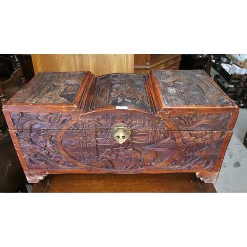 587 - A mid 20th century Chinese carved camphorwood blanket box