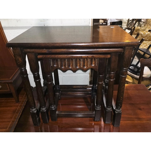 674 - A nest of 3 oak period style occasional tables