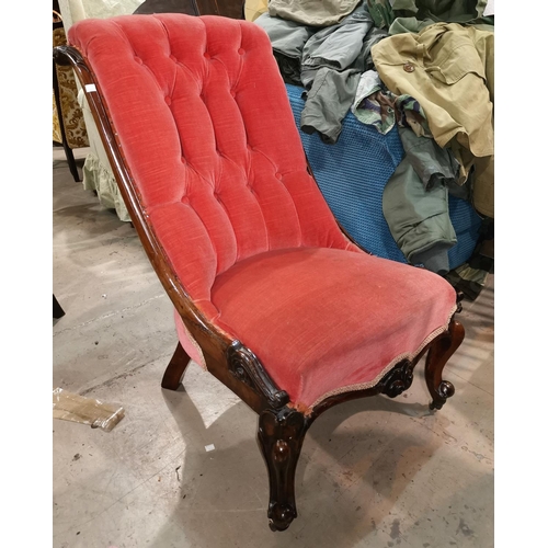 701 - A mahogany high back nursing chair on knurled legs, salmon pink buttoned upholstery