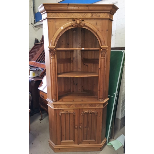 714 - An architectural pine corner cupboard with column decoration, open shelves above and cupboard bellow