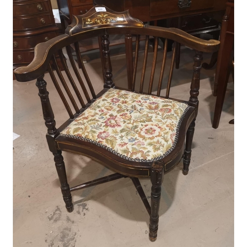 629 - An Edwardian inlaid corner armchair