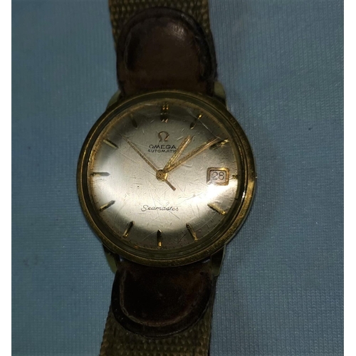 304C - A gents Omega Seamaster automatic wristwatch with applied baton markers, date aperture in gold plate... 
