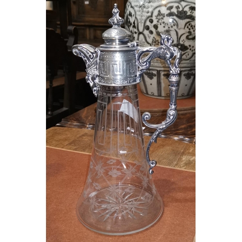 316 - A Victorian claret jug with silver plated mount and etched decoration