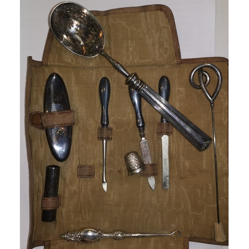 357 - A silver hatpin by Charles Horner; a silver thimble; a silver mounted manicure set; etc.