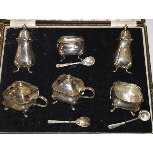 361 - A silver Georgian style 6 piece cruet set with matching spoons, cased