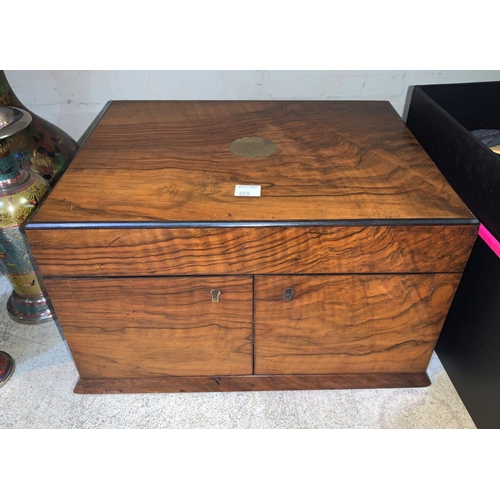 459 - A Victorian figured walnut workbox with hinged top and twin side doors