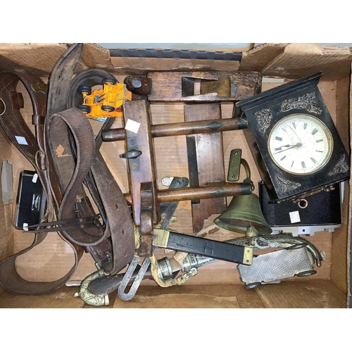 518 - A small Victorian mantel clock in ebonised case; vintage army and other belts; a 19th century plough... 