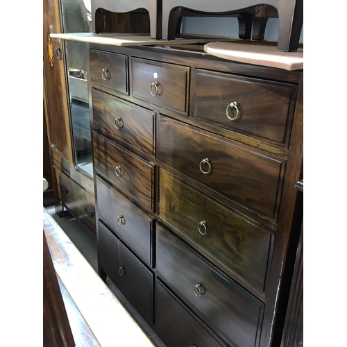 695 - A Stag mahogany bedroom suite comprising large chest of 11 drawers, kneehole dressing table and a pa... 