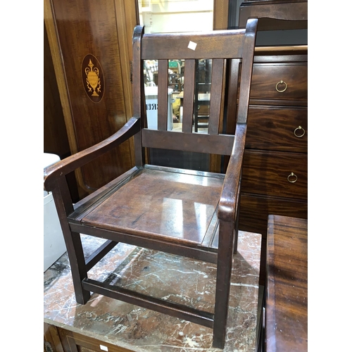 697 - A 19th century child's mahogany commode chair