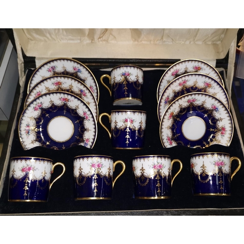203 - A Copeland Spode's set of 6 china coffee cups and saucers decorated with roses, cased