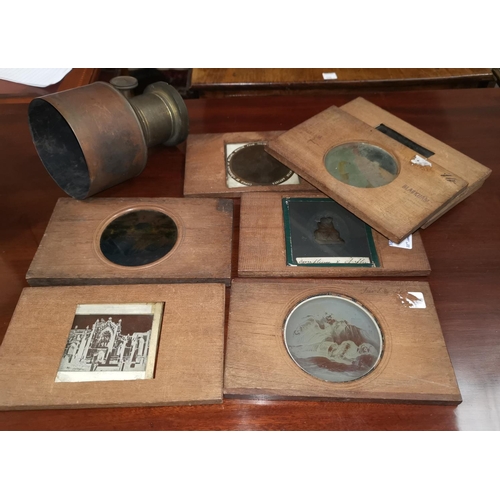 520 - 19th century magic lantern slides in wooden frame; a brass magic lantern lens