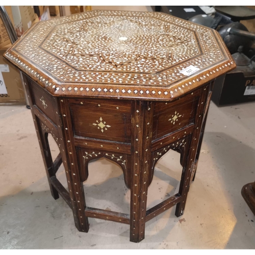 607 - A Middle Eastern octagonal occasional table with inlaid decoration; 2 plant stands