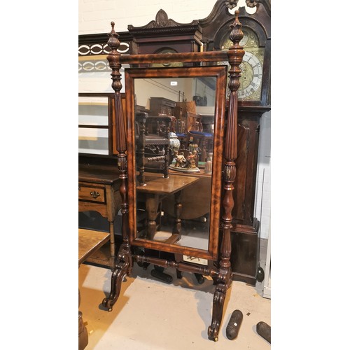 616 - A Victorian large cheval mirror on turned reeded columns and splay feet