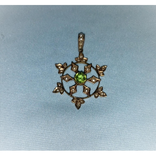 339 - An Edwardian 9 carat hallmarked gold pendant, circular star shaped set central peridot and seed pear... 