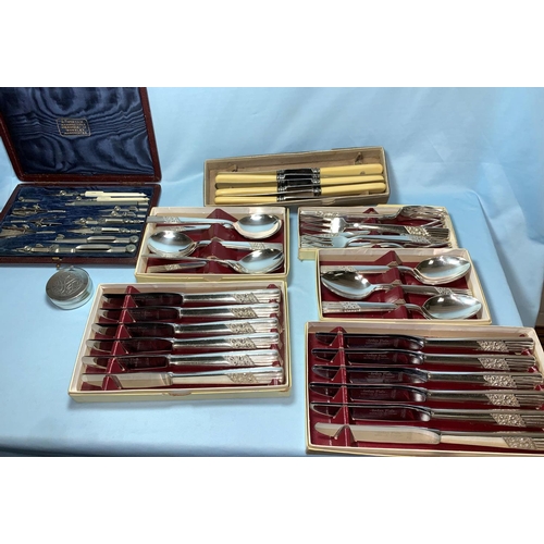352 - A silver plated 2 bottle tantalus; a geometry set; various cutlery