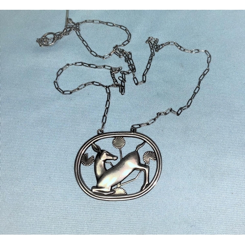 419 - Georg Jensen:  sterling silver necklace in oval frame, kneeling deer, width 4.5 cm, designed by Arno... 