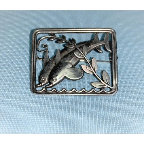 424 - Georg Jensen:  sterling silver rectangular brooch, 2 dolphins leaping through waves and frond, lengt... 