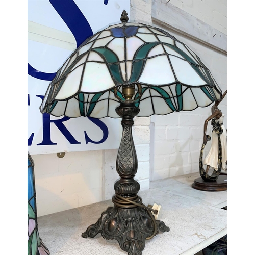 191 - A late 20th century Tiffany style bronzed table lamp with leaded glass shade