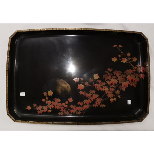 100a - An oriental large lacquerwork rectangular tray decorated with a settin sun and leaves, paper label o... 