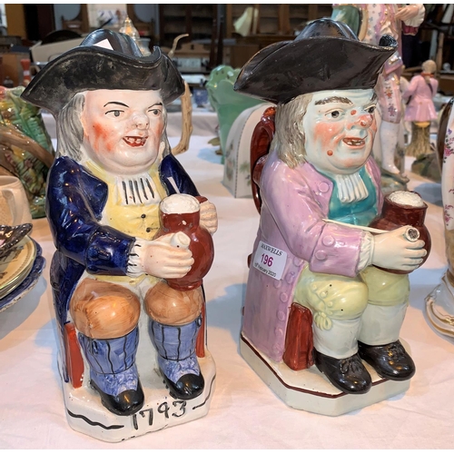 196 - A 19th century Ralph Wood style Toby jug, 25 cm; and another