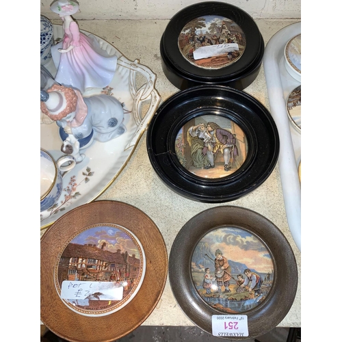 251 - Three 19th century pot lids, framed