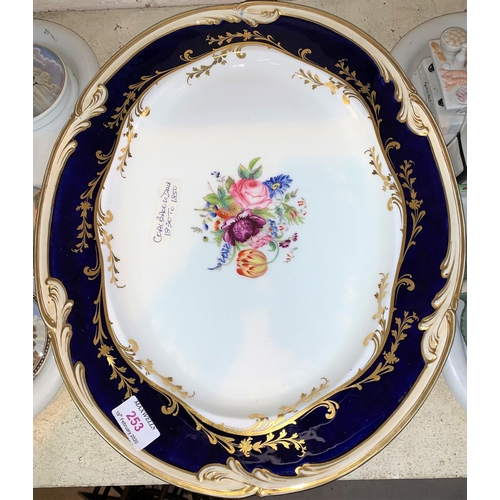 253 - A 19th century Coalbrookdale large oval dish decorated with a floral panel, blue and gilt border