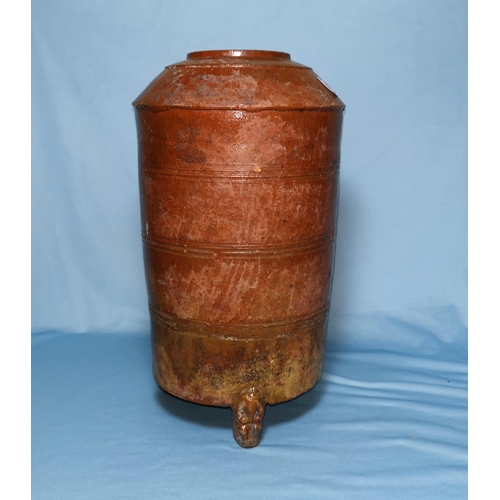 105 - A Chinese Tang dynasty terracotta urn of tapering cylindrical form, carried on 3 figural feet, glaze... 