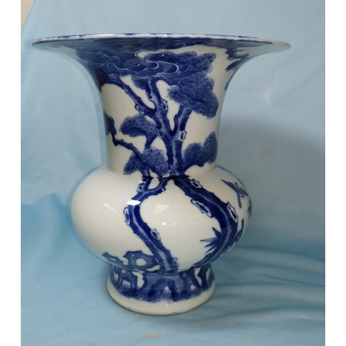 108A - A Chinese blue and white inverted baluster vase / spittoon with flared rim, decorated with birds on ... 