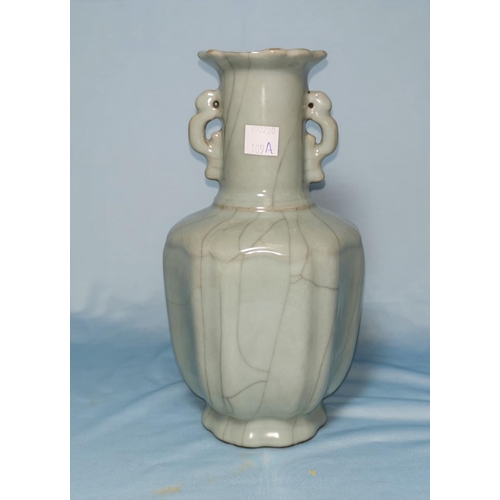 109A - A Chinese celadon crackle glaze ribbed vase, signature to base, 23cm (chip to rim)