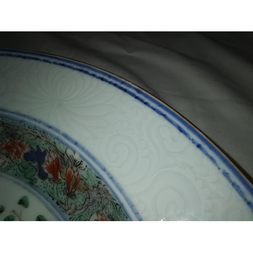 110B - A Chinese Kangxi period famille verte plate with central floral decoration, 29cm