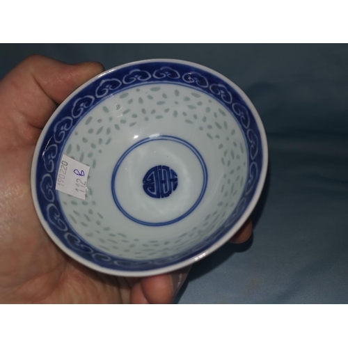 112B - A Chinese blue and white rice bowl with translucent decoration and character mark to base, diameter ... 