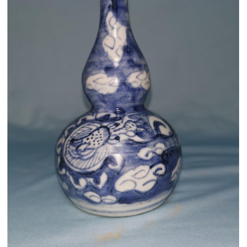 113A - A Chinese Ming blue and white double gourd shape vase decorated with dragons and clouds, with bronze... 