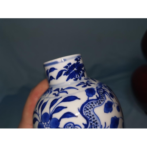 113C - An 18th century Chinese blue and white teapot (restoration to spout and lid0 another Chinese teapot ... 