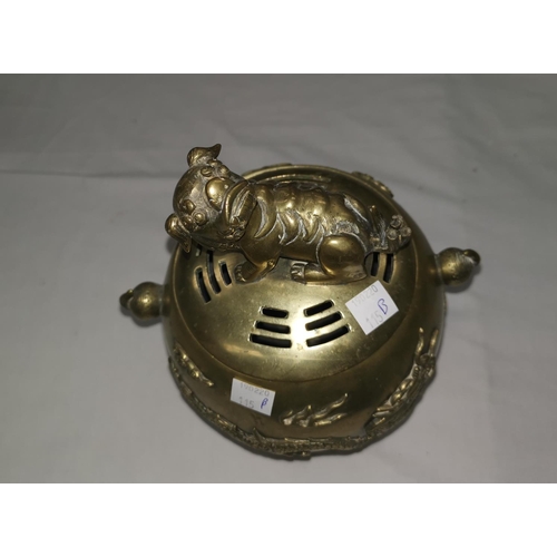 115B - A Chinese ovoid brass censer with dragon decoration and seated Dog of Fo to lid, character mark to b... 