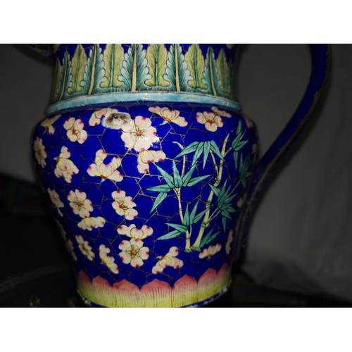 116A - A large Chinese blue enamel on copper jug with prunus and bamboo decoration, height 21cm (some patch... 