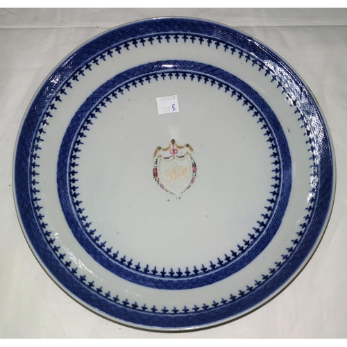 117c - An 18th century armorial dish with blue and white border and central cartouche