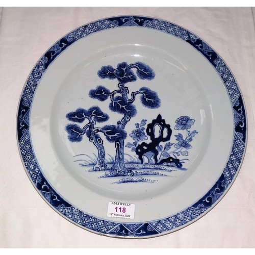 118 - An 18th century blue and white charger decorated with central tree, decorated 35.5cm