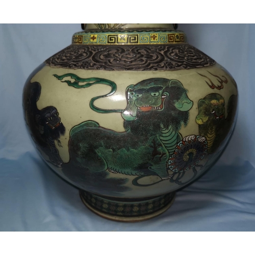 121 - A large late 19th century Chinese baluster  vase with dark brown glazed bronze effect rim and mounts... 