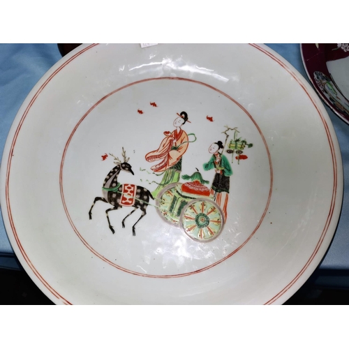 124c - A Chinese famille rose ceramic dish with central scene, 31 cm; 2 others (a.f.)
