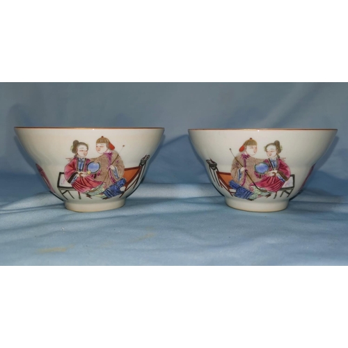 126b - A Chinese pair of ceramic tea bowls with polychrome decoration, marks to base