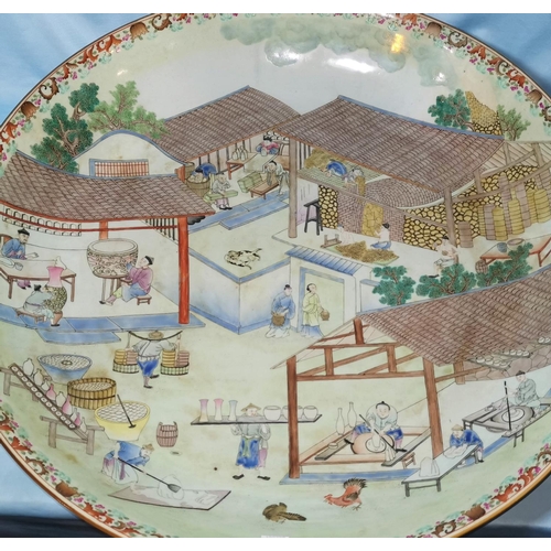 127A - A large impressive Chinese charger decorated extensively with a Chinese ceramic workshop scene in th... 