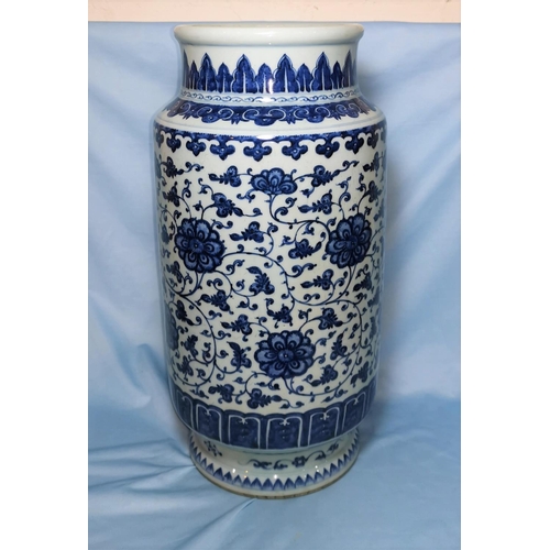 128A - A large blue and white cylindrical vase with floral decoration height 39cm