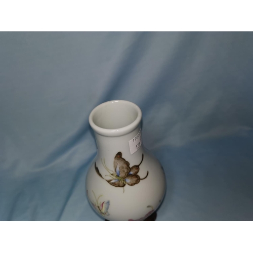 128B - A small Chinese baluster vase decorated with polychrome butterflies, six character mark to base