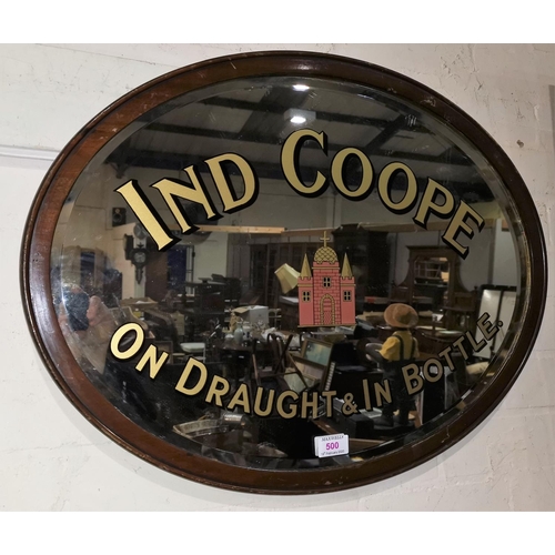 500 - An oval advertising wall mirror:  'Ind Coope', bevelled glass in mahogany frame, 50 x 65 cm overall