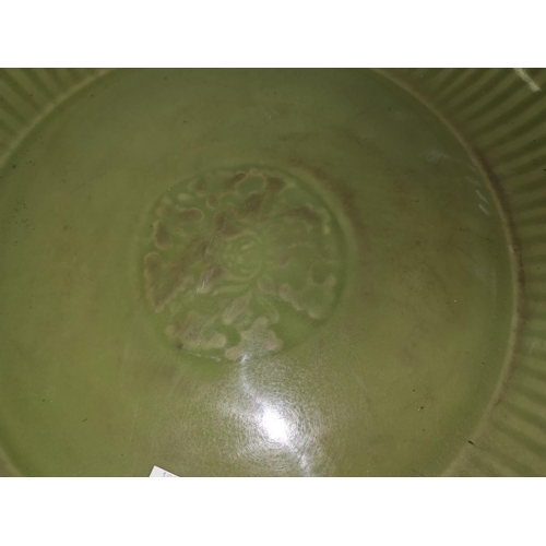 132C - A Chinese celadon charger with ribbed border diameter 36cm