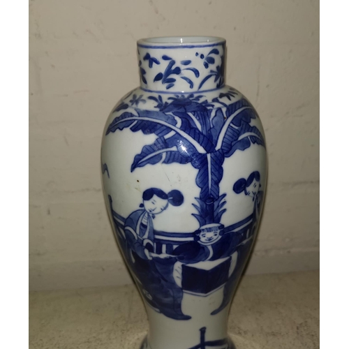 139 - A Chinese porcelain inverted baluster vase decorated in underglaze blue with a genre scene, 26 cm